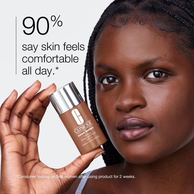Woman holding a bottle of Clinique Even Better Makeup Liquid Foundation SPF 15, with text showing 90% of users say skin feels comfortable all day.