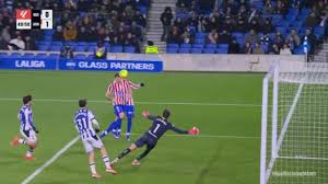 Atletico Madrid players celebrating goal during LaLiga match vs Real Sociedad